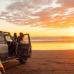 People on beach enjoying a beautiful sunset